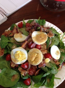 Latest favorite salad - spinach, hard-boiled egg, bacon, cherry tomatoes, blue cheese, carmelized red onions and homemade vinagarette